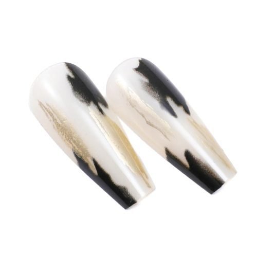 Detailed view of two pieces from a 24-piece set of coffin press-on nails, featuring an exquisite water painting nail art design in black and white.