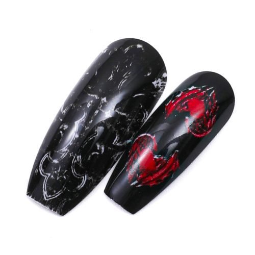 Detailed view of two pieces from a 24-piece set of coffin press-on nails, featuring a trendy nail art design against a bold combination of black and red.