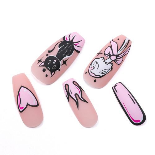 Close-up view of five pieces from a 24-piece set of coffin press-on nails featuring a charming cat painting nail art design, in a mixture of light pink and pink hues.