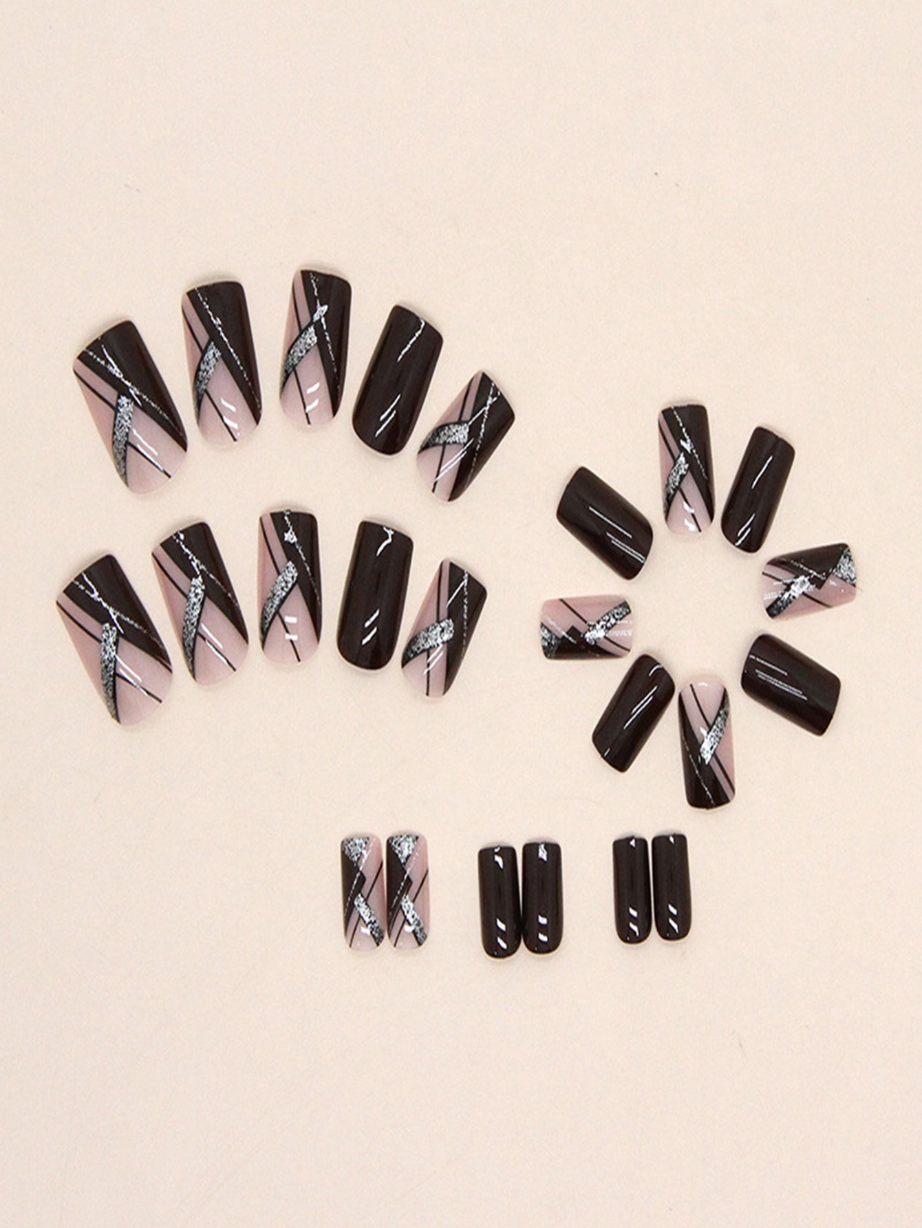 Close-up top-down view of square-shaped press-on nails set, highlighting the detailed wine red and silver glitter bars on the pink background.