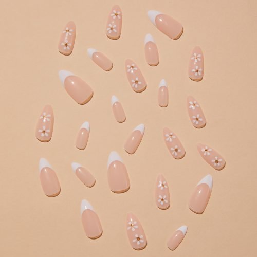 Overhead shot of a 24-piece set of almond-shaped press-on nails with two distinct designs: nude shade with white French tips and nude shade with floral patterns.