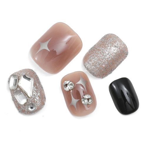 Five squoval press-on nails in varied designs: black, ombre red adorned with diamonds, and glitter dip also with diamonds.