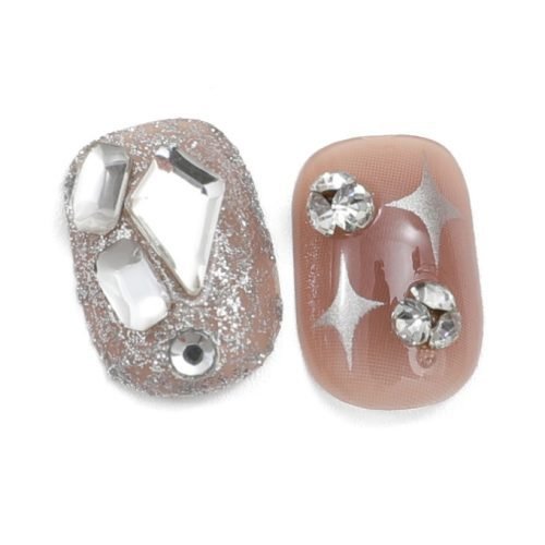 Pair of squoval press-on nails, one in ombre red with diamonds and the other in a glitter dip shade with diamonds.